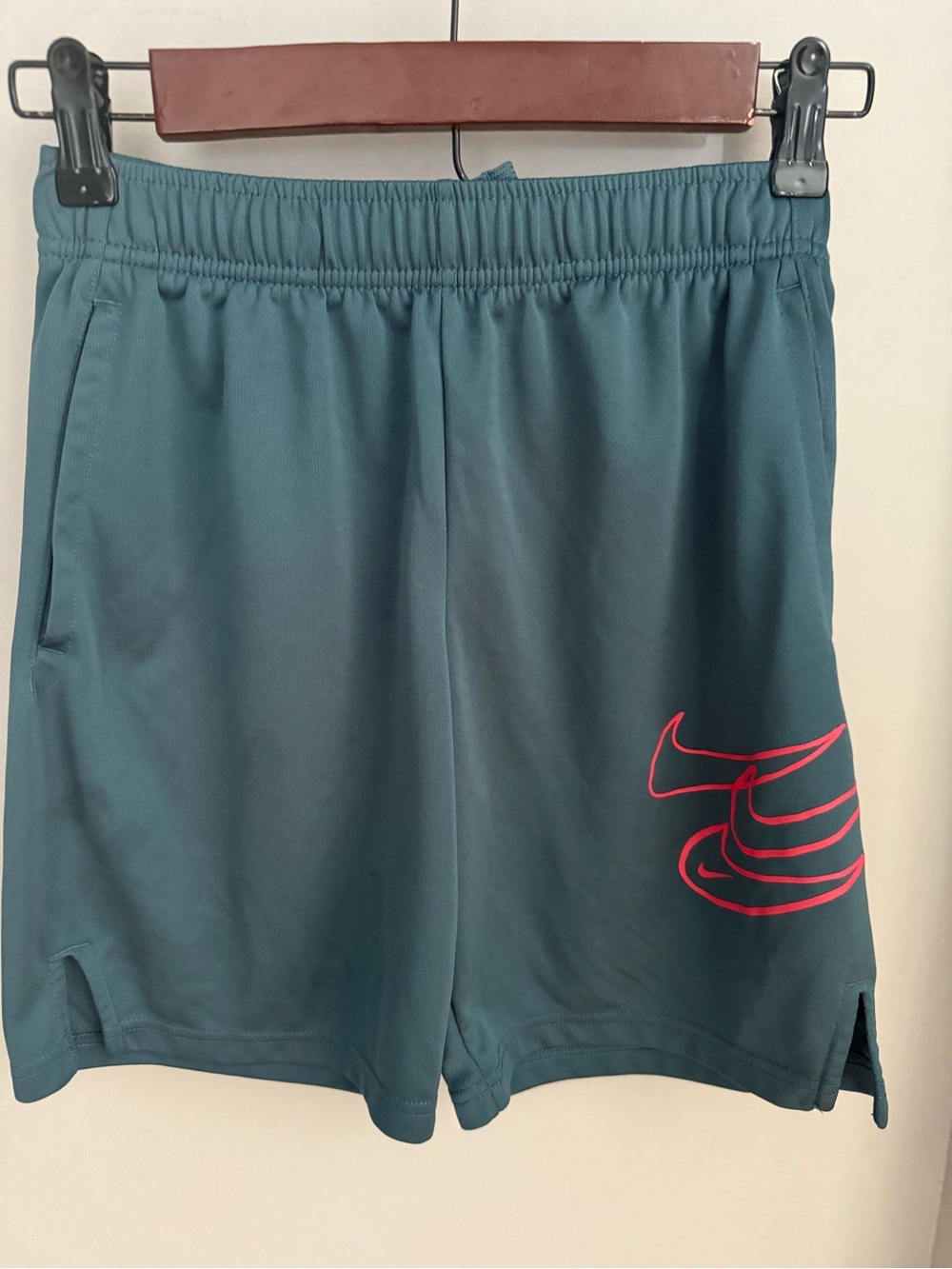 Nike boys Teal Athletic Shorts with coral Swoosh size medium